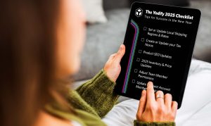 A professional checking off their Yodify new years checklist for their b2b site